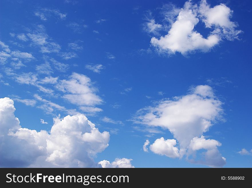 White clouds in a blue sky. Great background. White clouds in a blue sky. Great background