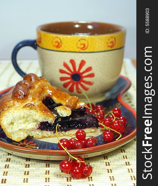 Fresh sweet pie with bilberry and cup of tea. Fresh sweet pie with bilberry and cup of tea