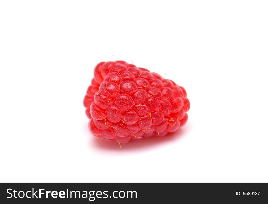 Red ripe raspberry on a white background