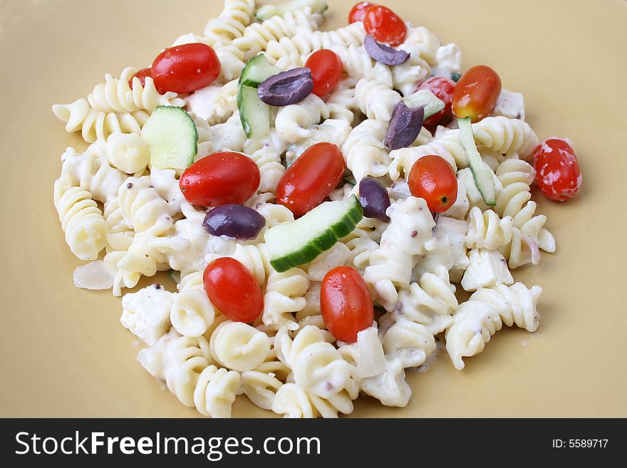 Cold Pasta Salad with tomatoes, cucumbers and olives. Cold Pasta Salad with tomatoes, cucumbers and olives