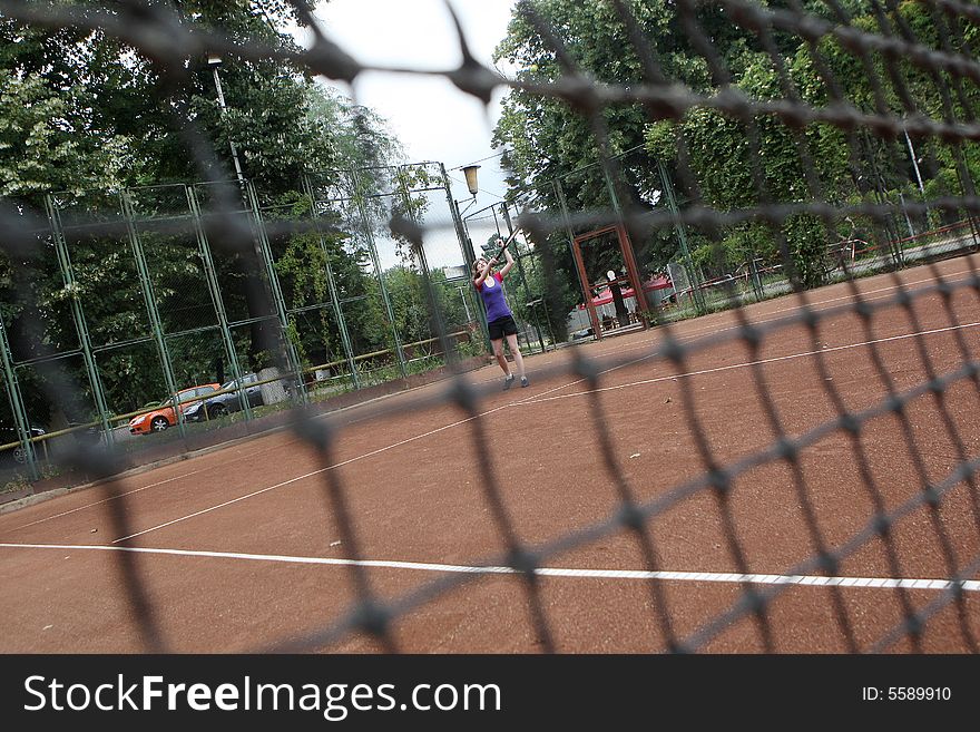 A tennis player in the game. A tennis player in the game