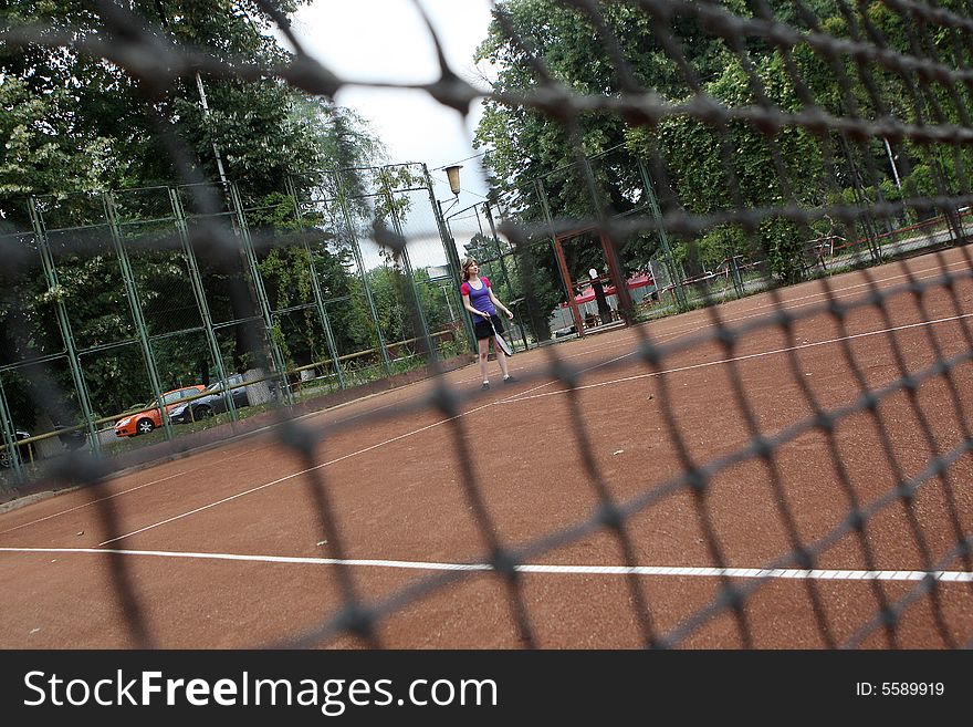 A tennis player in the game. A tennis player in the game