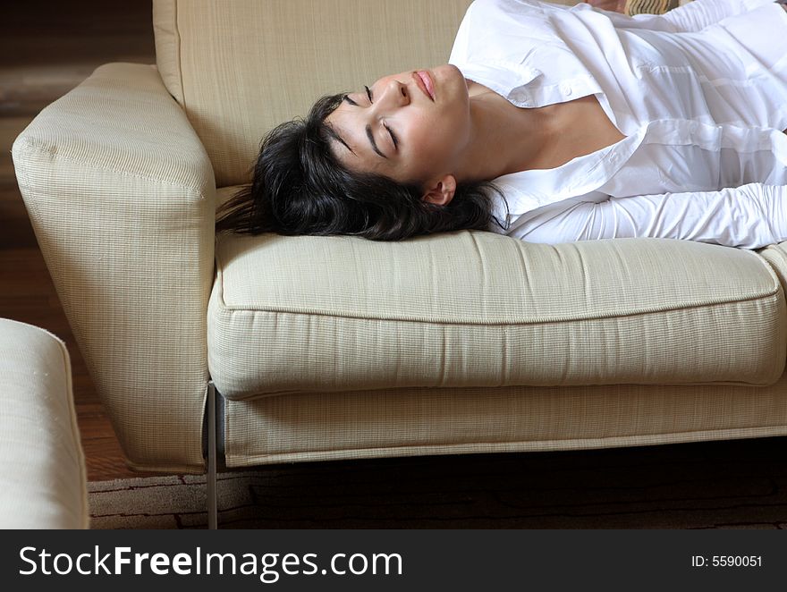 A woman sleep on the divan