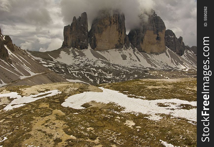 Tre Cimes in Italy, dolomites, just coming out of the clouds. Tre Cimes in Italy, dolomites, just coming out of the clouds.