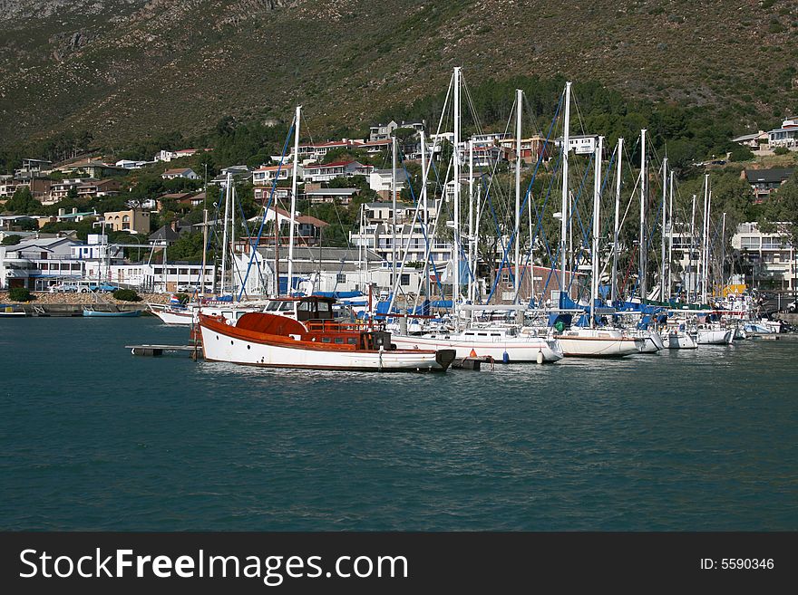 Gordons Bay Harbour in South Africa with boats lined up