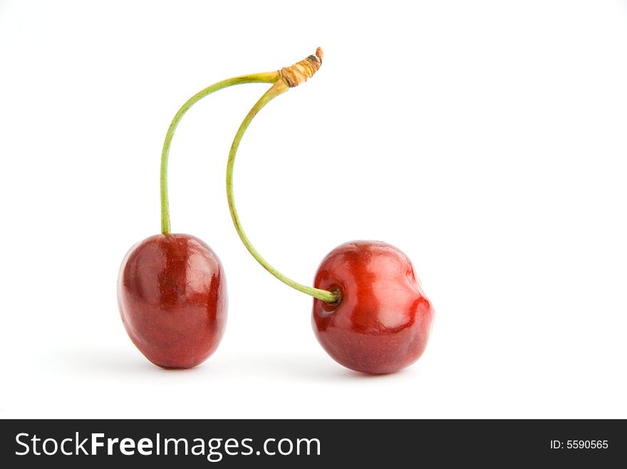Two cherries isolated over white background. Two cherries isolated over white background