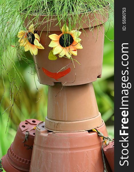 Smiling face and flower pots
