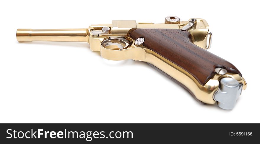 Golden gun isolated over a white background