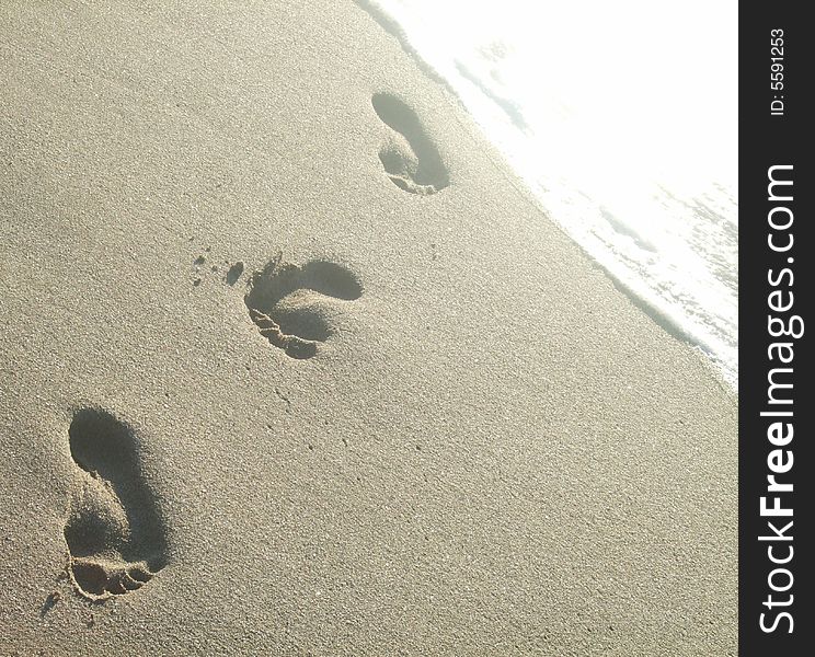 The footprints on the sea sand (background)