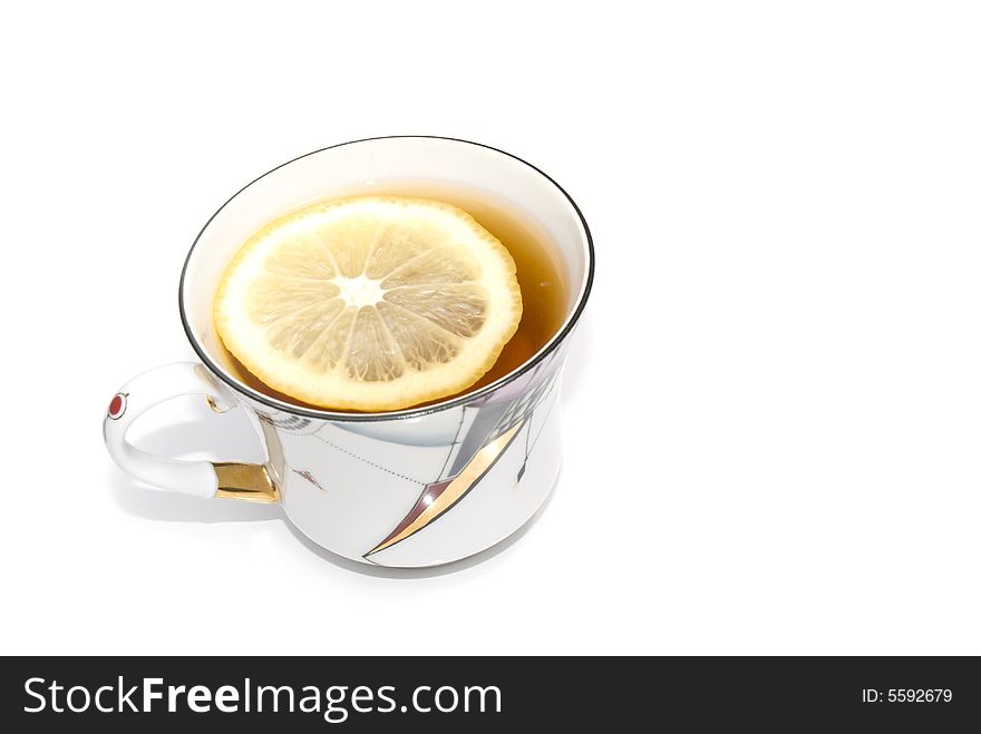 One cup of black tea with a slice of lemon. One cup of black tea with a slice of lemon