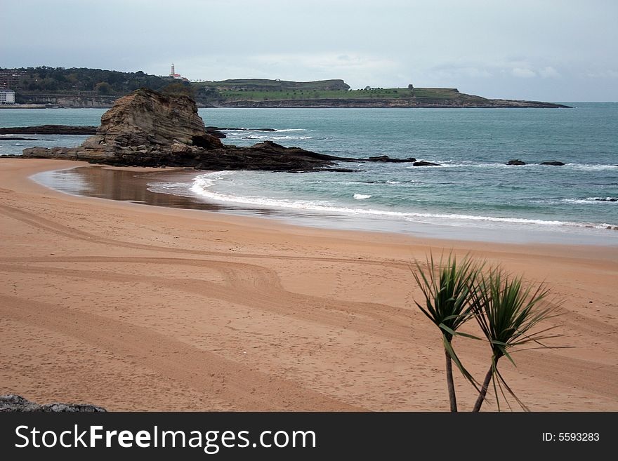 Long sand beach in a peninsula in the entrance to a bay of Santander