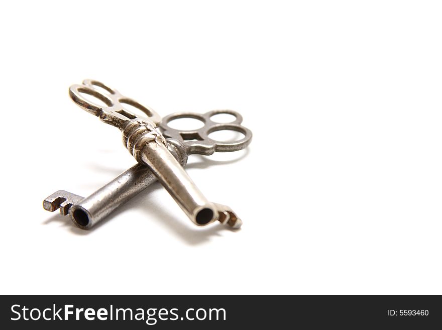 Isolated shot of two metal antique keys on white background. Isolated shot of two metal antique keys on white background