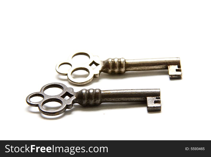 Isolated shot of two metal antique keys on white background. Isolated shot of two metal antique keys on white background