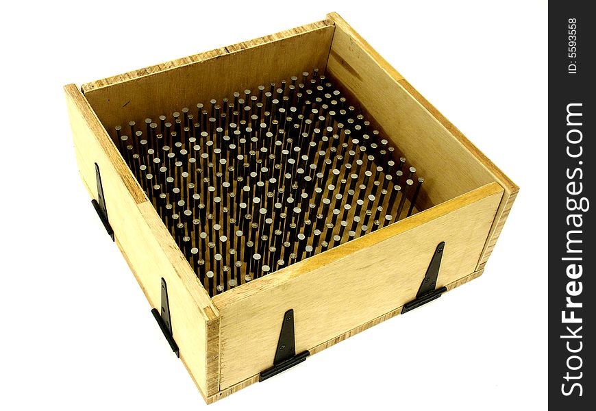 Wooden box filled with nails. Wooden box filled with nails
