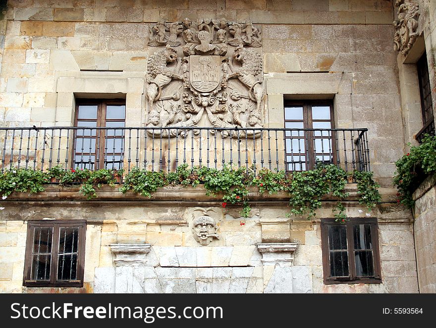 Court of Arms on a facade of a historic stone typical decorated house in Santillana del Mar, Cantabria