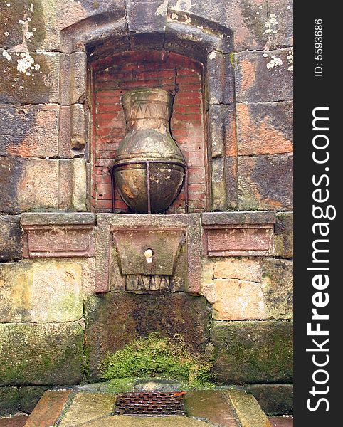 Old historic typical fountain in a street in Santillana del Mar, Cantabria