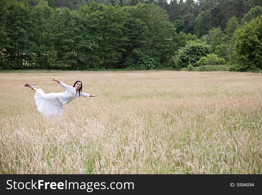 Happy woman jumping on green meadow. Happy woman jumping on green meadow