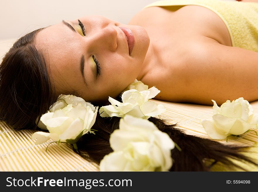 Attractive brunette woman relaxing in massage. Attractive brunette woman relaxing in massage