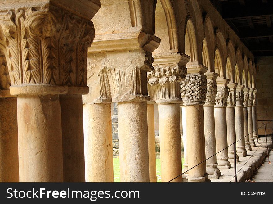 Columns in line in a courtyard of monastery La Colegiata, Santillana del Mar, Cantabria