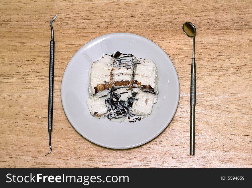 Breakfast - icecream in the plate and dental instruments. Breakfast - icecream in the plate and dental instruments