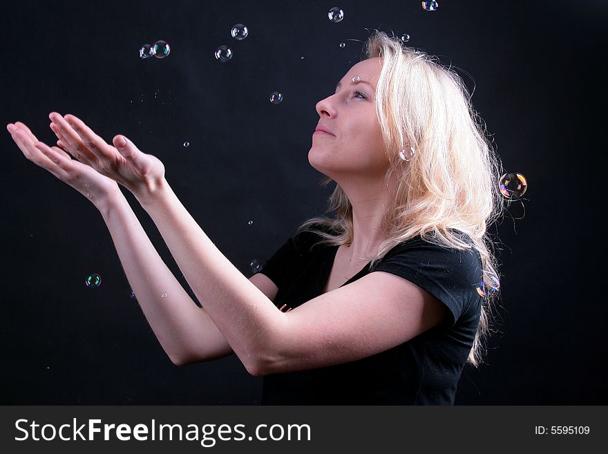 Photo of attractive woman on black background with boubles. Photo of attractive woman on black background with boubles