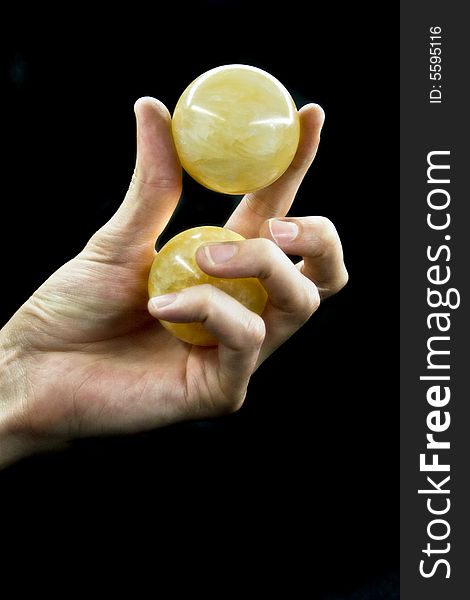 Hand with the ball on a black background. Hand with the ball on a black background