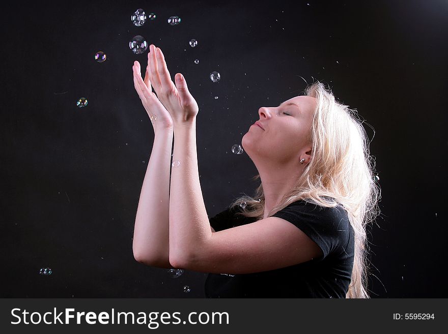 Photo of attractive woman on black background with boubles. Photo of attractive woman on black background with boubles