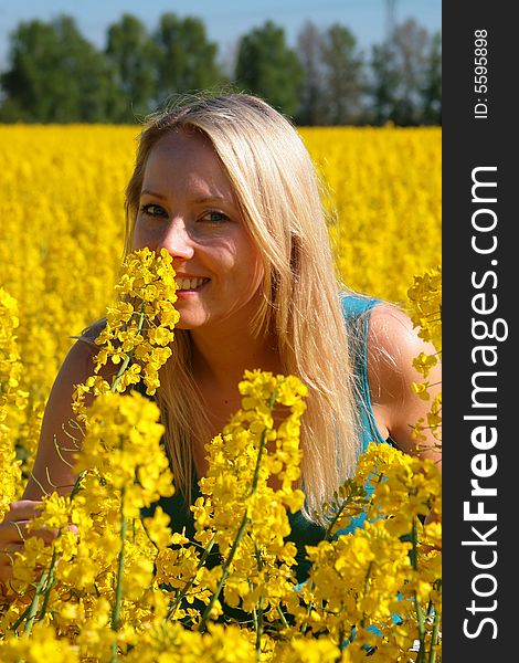 Photo of attractive woman in yellow flowers