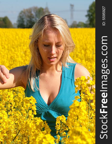 Photo of attractive woman in yellow flowers