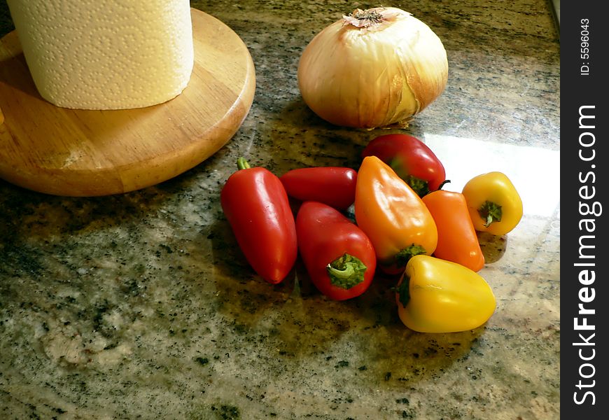 Photo with copy space of sweet peppers on a kitchen counter. Photo with copy space of sweet peppers on a kitchen counter