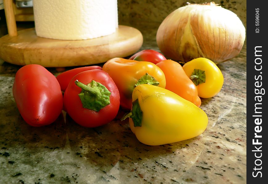 Photo of sweet peppers on a kitchen counter. Photo of sweet peppers on a kitchen counter