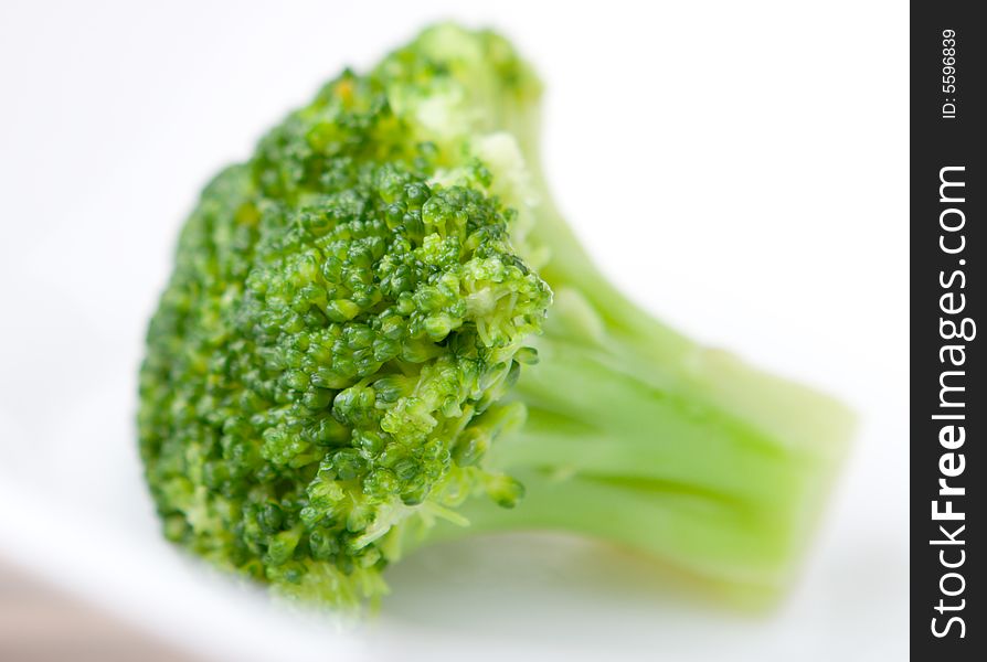 Fresh broccoli in the dish close up