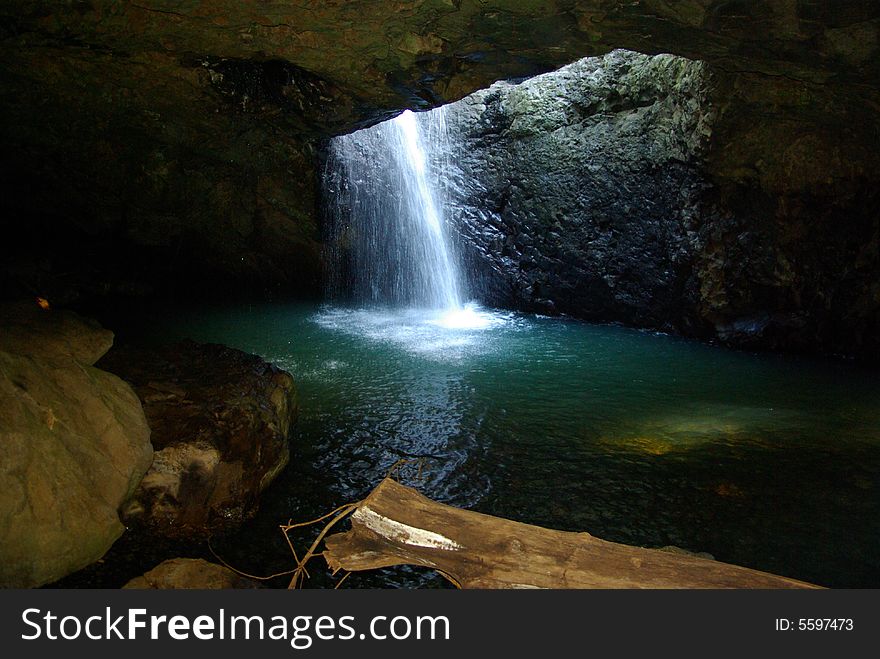 Natural Bridge, a bridge in the roof of a cave with a waterfall through the roof; inside the cave, capturing the waterfall cascading into the stream that it feeds as it flows from the cave. Natural Bridge, a bridge in the roof of a cave with a waterfall through the roof; inside the cave, capturing the waterfall cascading into the stream that it feeds as it flows from the cave