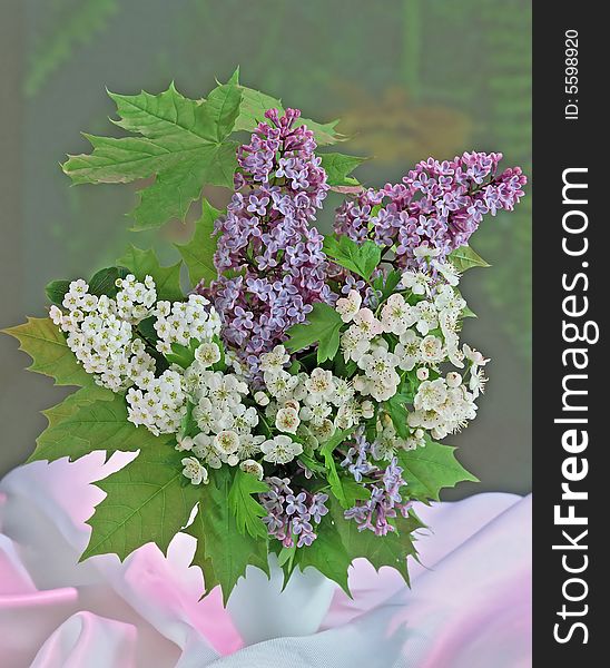 Lilac and tiny white flowers in vase. Lilac and tiny white flowers in vase
