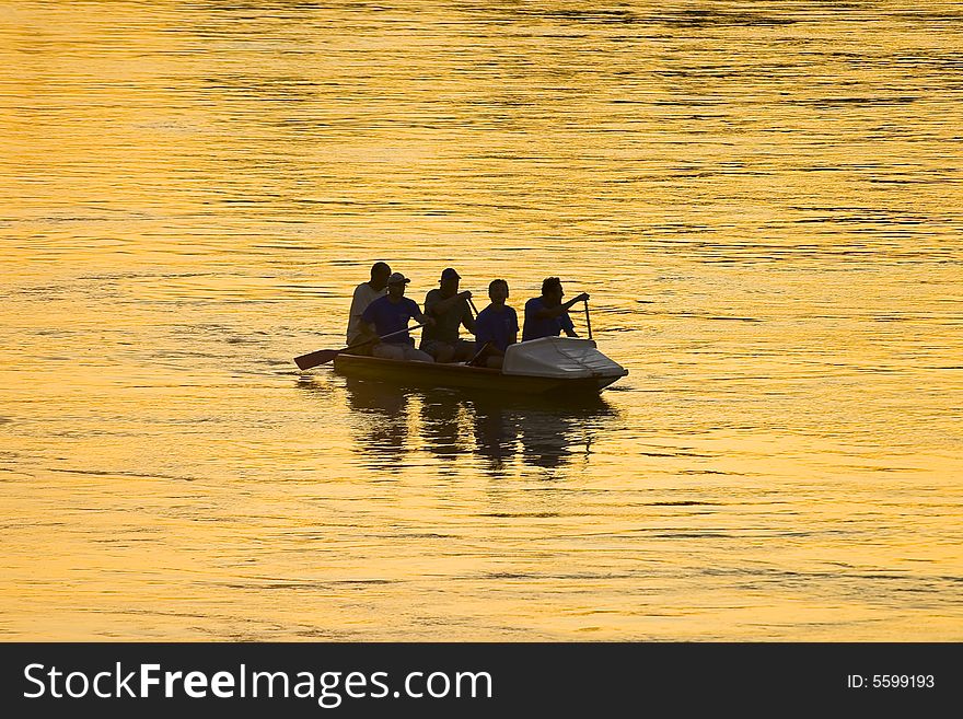 The picture of boat  whit silhouette of people. The picture of boat  whit silhouette of people
