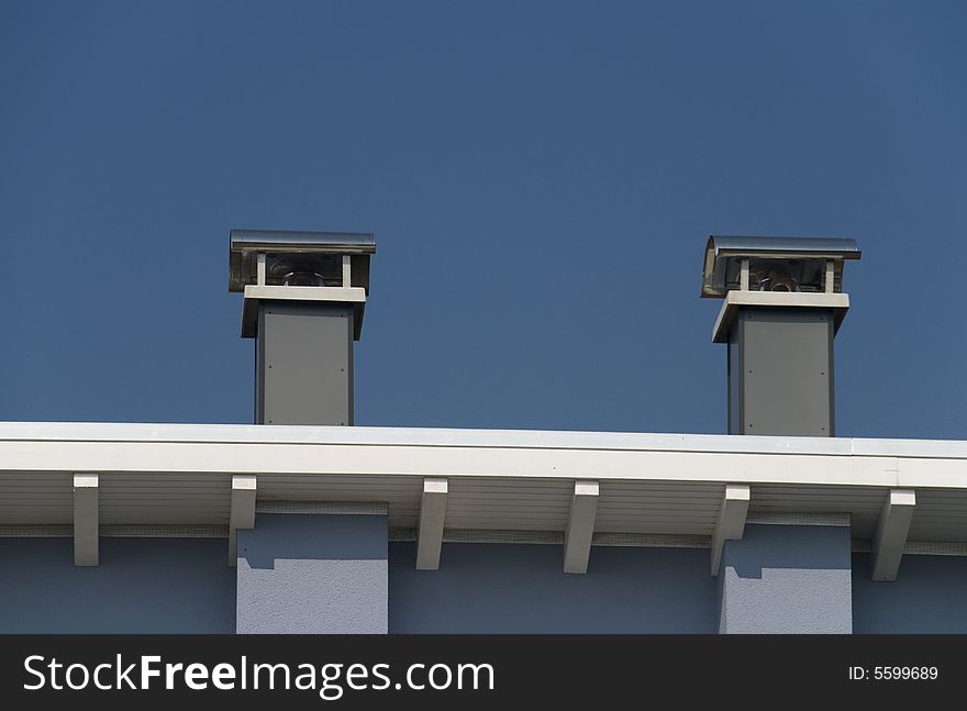 Two chimneys in the blue sky