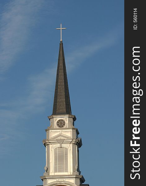 Church steeple against blue sky