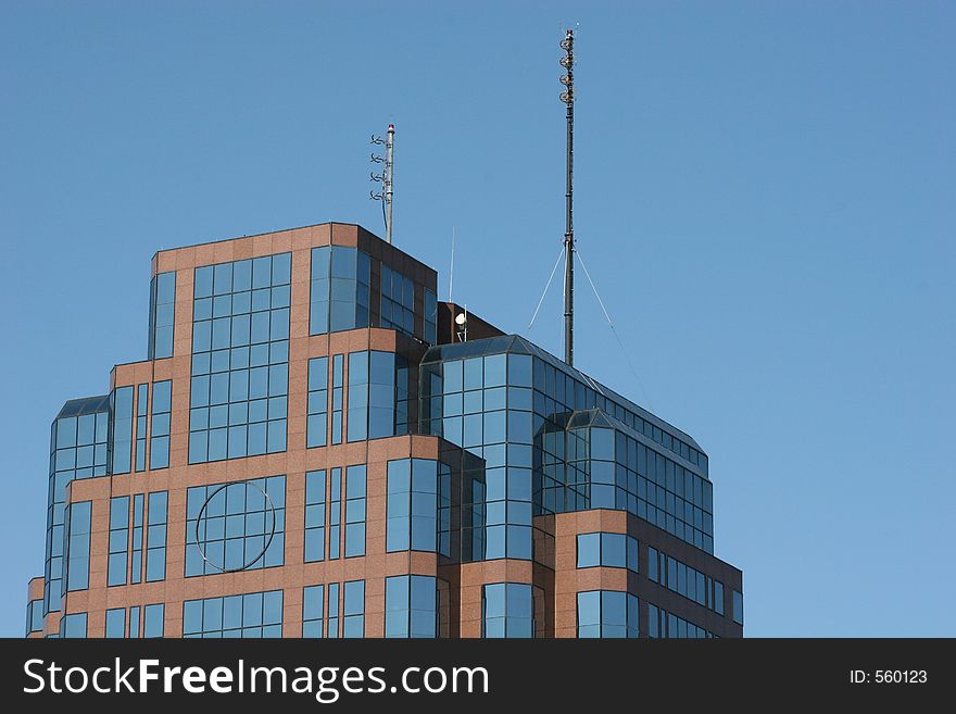 Brick and Glass office building against blue sky