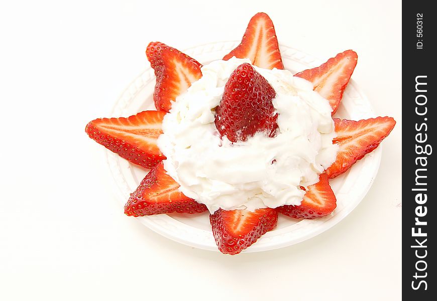 Cake surrounded by strawberries with whipped cream. Cake surrounded by strawberries with whipped cream.