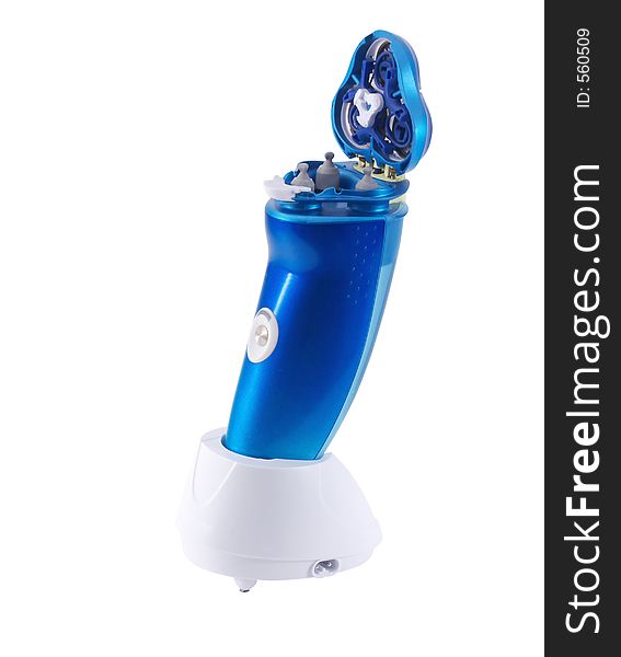 Electric razor in charging stand, on white background with clipping path. Electric razor in charging stand, on white background with clipping path