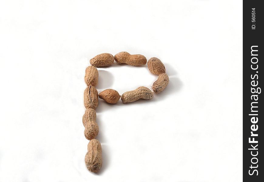 Letter P made of peanuts, on white background. Letter P made of peanuts, on white background