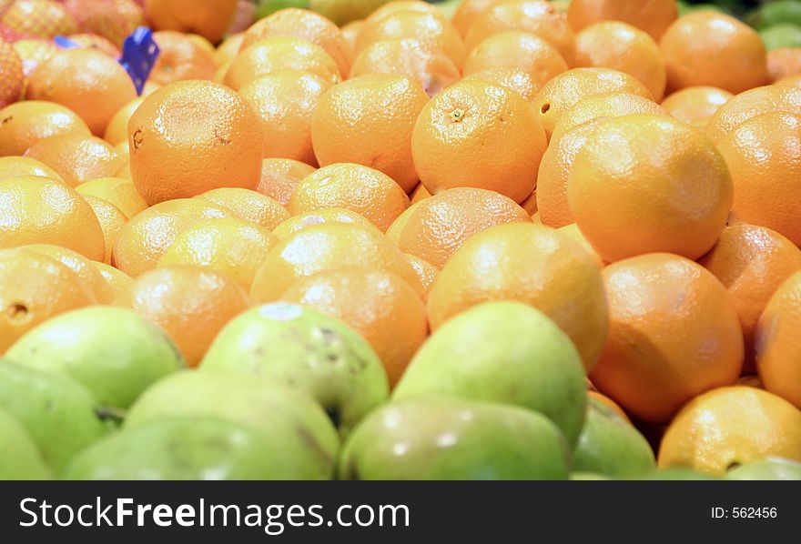 Oranges and apples in store
