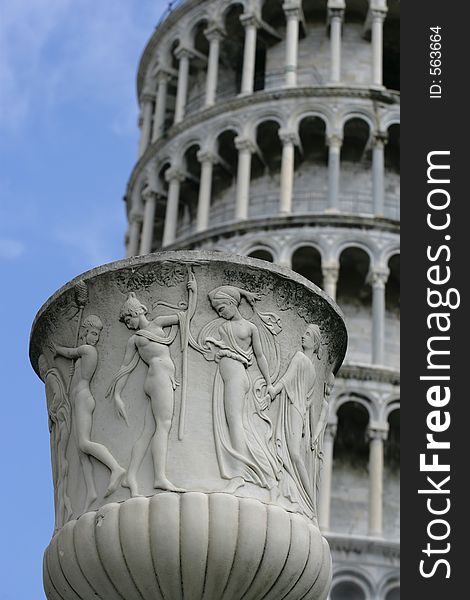 A pot in focus in front of the blurred Leaning Tower of Pisa. (9.5 x 14 image). A pot in focus in front of the blurred Leaning Tower of Pisa. (9.5 x 14 image)