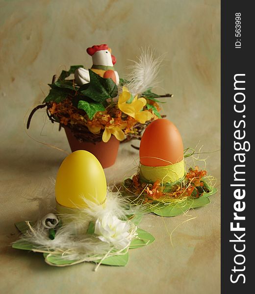 Easter eggs in cardboard holders with flowers and feathers. Easter eggs in cardboard holders with flowers and feathers