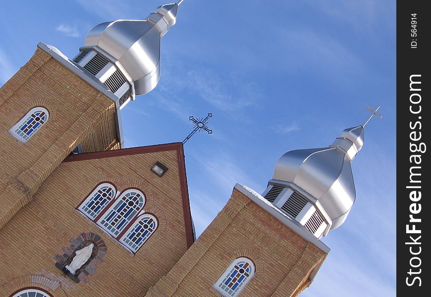 This image depicts a Ukrainian-style church at an angle. This image depicts a Ukrainian-style church at an angle.