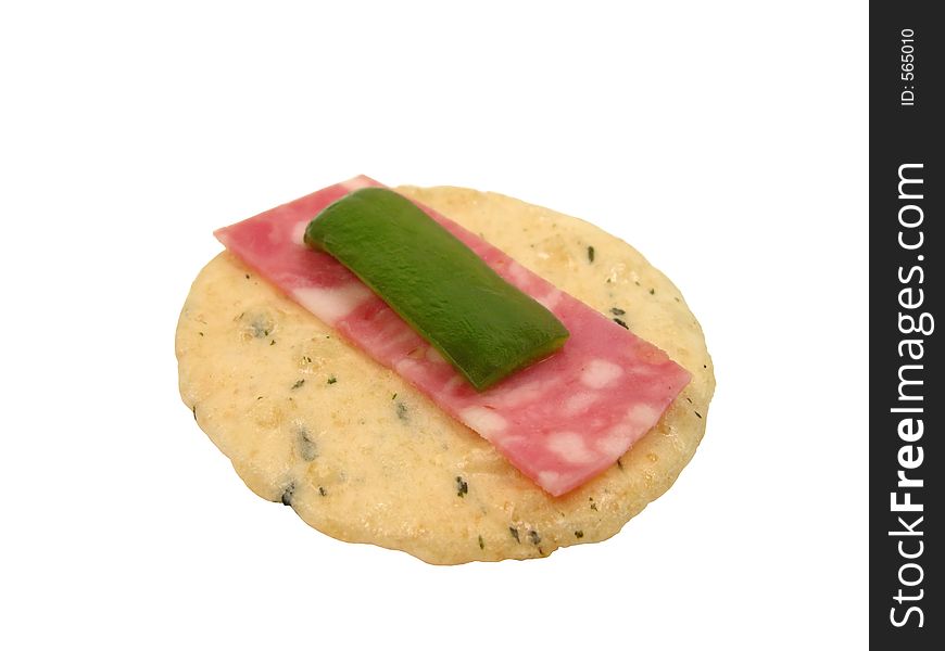 A chip,a little piece of salami and a piece of green pepper-a special snack sandwich-isolated over white background. A chip,a little piece of salami and a piece of green pepper-a special snack sandwich-isolated over white background