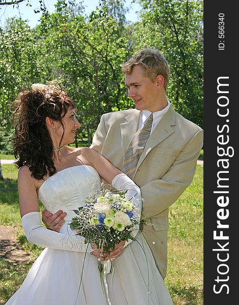 Portrait newlyweds in park. Portrait newlyweds in park