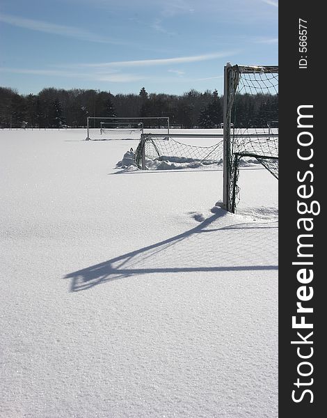 Snow covered soccer-field with goals. Snow covered soccer-field with goals