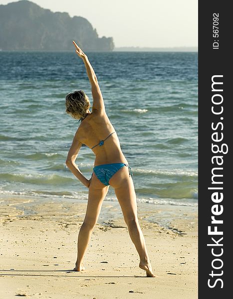 Girl exercising on the beach. Girl exercising on the beach