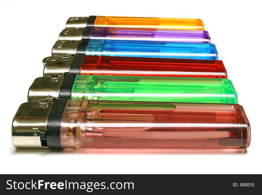 Colorful line of lighters isolated on white